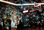 Sabrina Ionescu watches a tribute to Kobe Bryant as fans turn the lights on their phones at Matthew Knight Arena. 