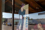 A George Strait cutout with a mask stands in the Fossil Mercantile reminding customers to wear a mask in Fossil Mercantile on September 4, 2020, in Fossil, Oregon. 