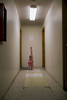 1-year-old Harley Savard holds Christmas wrapping paper in the hallway near the apartment she lives in with her parents, Caitlin Savard and Robbie Savard, above Jim's Landing in Springfield on Friday, November 21, 2014. The fire marshal’s office notified tenants in the Jim's Landing building in Springfield on Friday, November 21, 2014 that they need to vacate within 48 hours. Fire officials found numerous code violations after a fire on November 11, 2014 that they say makes the building inhabitable. (Andy Nelson/The Register-Guard)