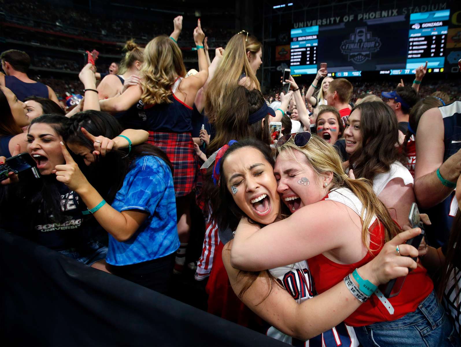 Gonzaga fans celebrate after the Bulldogs won their national semifinal game against South Carolina at University of Phoenix Stadium in Glendale, Arizona. 