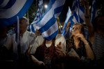 Athens Greece June 15, 2012Supporters waving flags at the pre-election speech of Antonis Samaras the leader of the New Democracy conservative party.