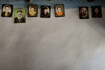 Khorog, Tajikistan 2011-Family portraits are hanged on the wall at a house outside of Khorog.