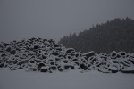 Tires lie beneath a blanket of freshly fallen snow in Minamisanriku, Japan.
