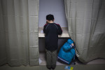 Two young boys finish their homework at a community center in a temporary housing complex near Minamisanrku, Japan.