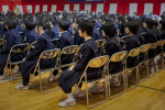 Students attend a graduation ceremony at Shizukawa Junior High School in Minimasanriku, Japan on March 10, 2012, one day before the anniversary of an earthquake and tsunami that almost completely wiped out the town. The school was a tsunami evacuation zone, and one of only a few buildings that remain intact in the city. 