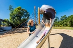 Mother and child playing in the Outlook estate playground in Cairns for Fortress Developments