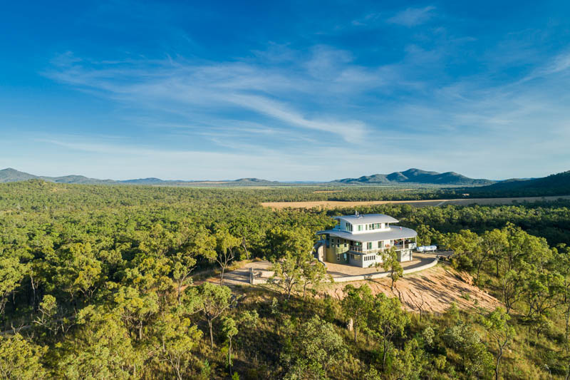 Aerial view of remote residential home atop hill at Walsh River,  Atherton Tablelands
