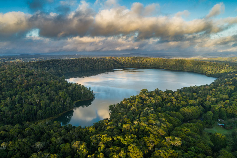 Aerial view over Lake Barrine, surrounded by rainforest on the Atherton Tablelands 