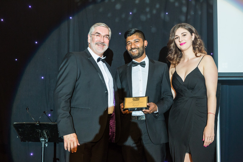 Award winner being presented award at 2017 Clark Rubber Conference Gala Dinner & Awards Night, Cairns