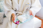 Customer holding refreshment towel during Spa treatment at The Reef House Palm Cove