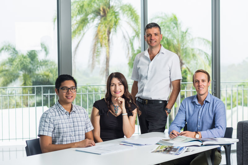Group portrait of construction business staff, Cairns