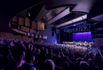 People watching a musical performance onstage at the Cairns Performing Arts Centre 
