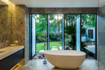 Bathtub with garden backdrop at residential home in Cairns
