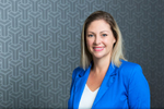 Headshot for female construction company administrator with patterned background, Cairns