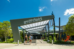 Family at entrance to the Smithfield Shopping Centre Entertainment Leisure Precinct in Cairns