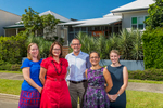 Group photo of law firm employees with business building in background, Cairns
