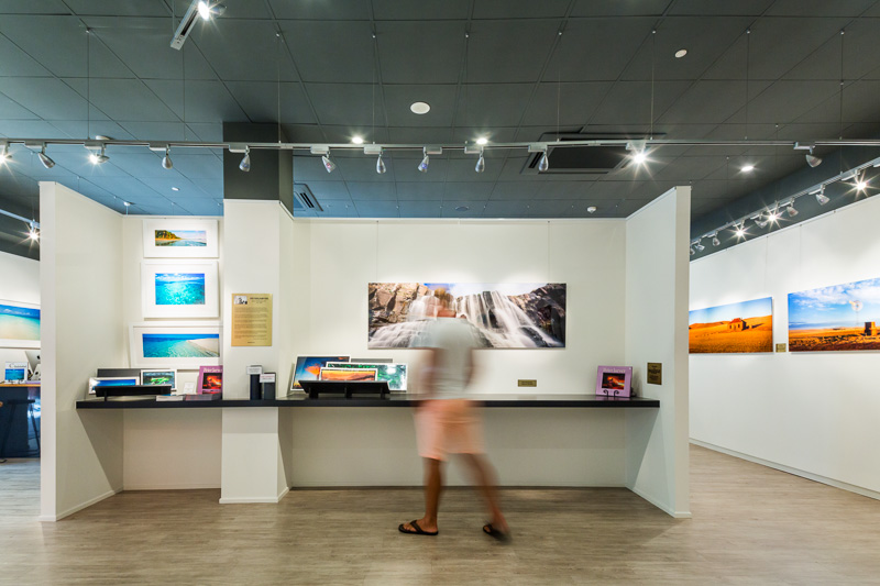 Visitor walking through interior of the Peter Javer Gallery in Cairns 