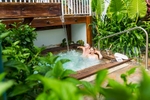 Young couple relaxing in the spa at The Reef House Palm Cove in Cairns