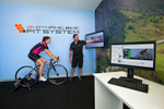 Cyclist getting her bike fitted using a technolody based system at Avantiplus store, Cairns