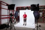 White backdrop and lighting setup for commercial portrait shoot at Bunnings Cairns