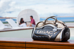 Callaway Legacy weekender bag on cruise liner with couple in background, Cairns 