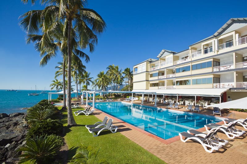 Pool and accommodation on the waterfront at Coral Sea Resort in Airlie Beach