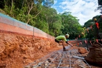 A worker lays re-inforcement steel for a slope stabilization project, near Cairns