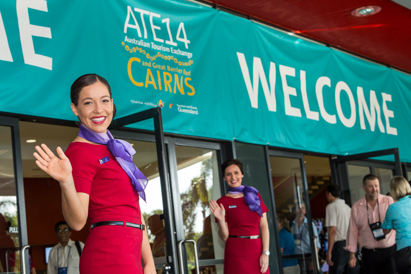 Virgin Australia cabin crew greeting arriving delegates at 2014 Australian Tourism Exchange in Cairns