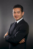 Portrait of Asian business executive with grey background, Cairns
