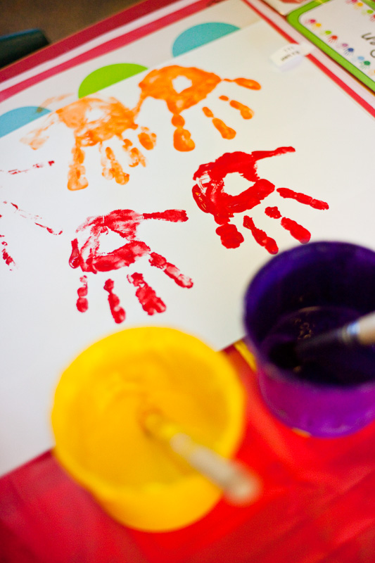 Colourful handprints in kids art class 