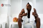 Portrait of basketball player Larry Abney sitting in locker room by professional photographer Cairns