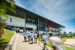 Blurred movement image of students walking up to school library