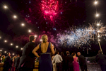 Couple watching fireworks display at Cairns Amateurs Ball 2015 on the waterfront

