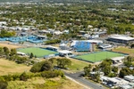 Aerial view of sporting precinct including hockey fields and swimming pool, Cairns