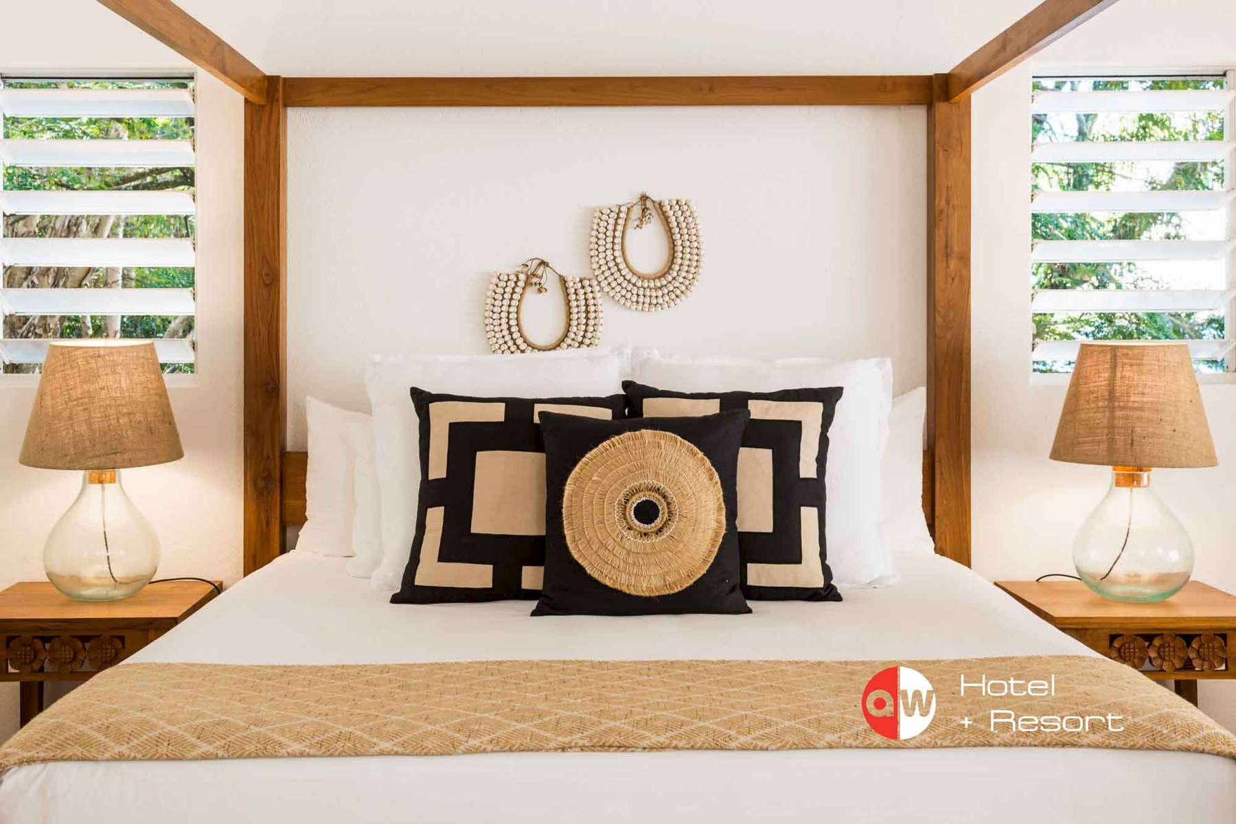 A bed in a room at The Reef House Resort at Palm Cove - commercial photographer Cairns