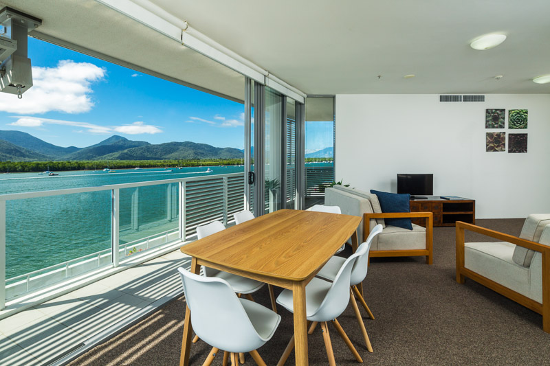 Apartment dining area overlooking the harbour at Cairns Harbour Lights