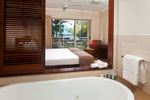 View of bathtub through to hotel bedroom at Mantra Amphora, Palm Cove.
