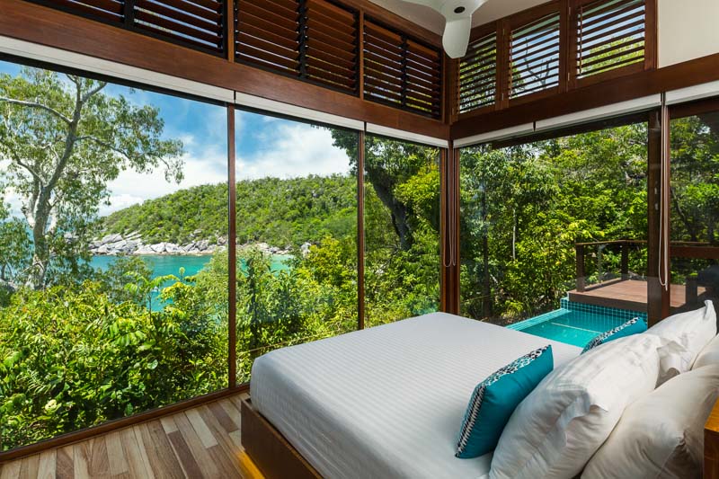 Villa bedroom overlooking the beach at Bedarra Island Resort