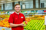 Business portrait of staff member in produce section of Coles Earlville, Cairns
