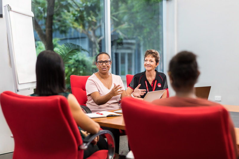 A business studies student in an office meeting at Cairns campus of TAFE Queensland