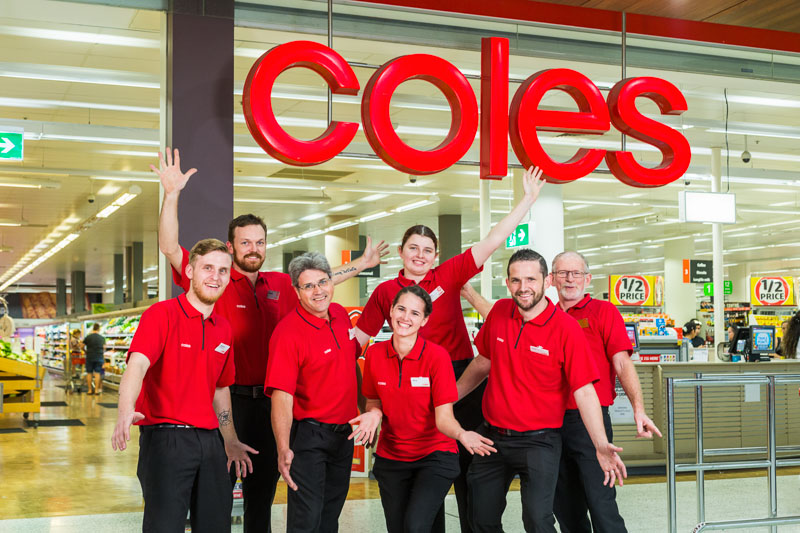 Group photo of Coles Earlville service team at Stockland Shopping Centre in Cairns