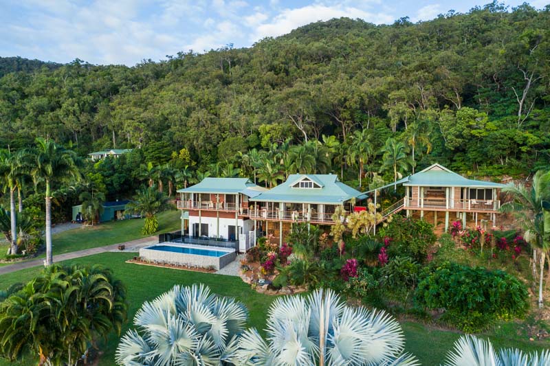 Aerial view of residential property backed by forested hills at Killaloe, Port Douglas