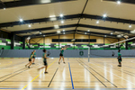 Children playing volleyball in high school sports hall, Cairns 
