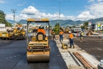 Road workers laying bitumen on a road construction project, Cairns