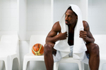 Portrait of professional basketballer, Larry Abney sitting in locker room, Cairns