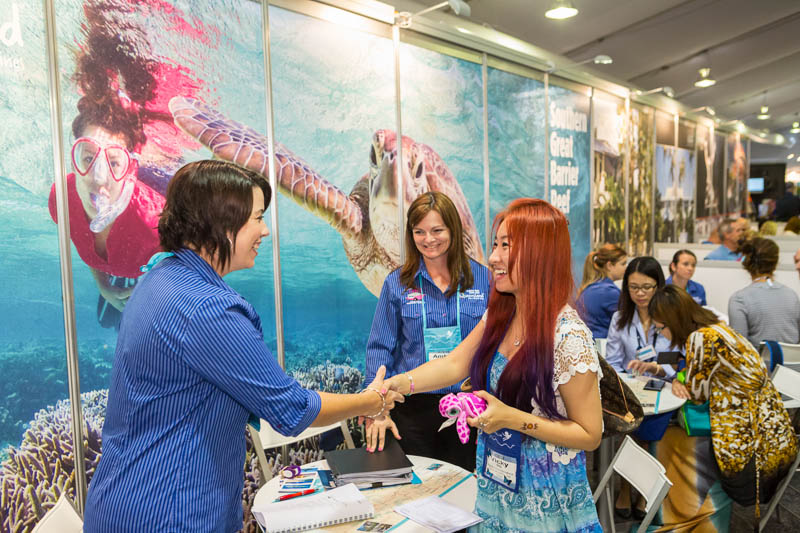 Delegates shaking hands at the 2014 Australian Tourism Exchange in Cairns 