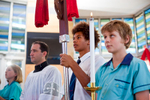 Students participating in a religious mass at a Catholic school