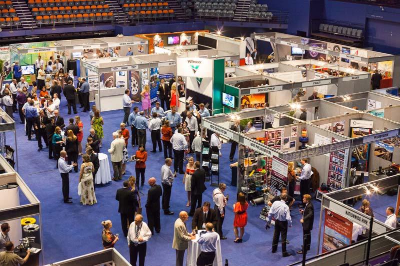 Delegates walking amidst the trade exhibit at the Australian Pipeline Industry Convention, Cairns