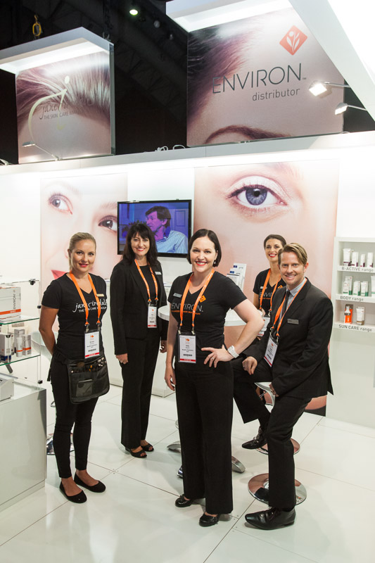 Portrait of booth staff at the Cosmetex 2012 Conference trade exhibition in Cairns