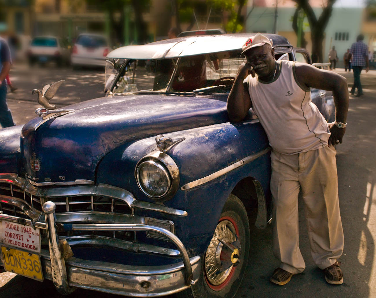 This vintage Dodge is one of the many cars that are a part of Cuban love for American cars and take pride in {quote}owning{quote} them. These cars cannot be sold or exported out of Cuba, they are part of the Heritage cars status, and owned by the state, {quote}sort of{quote}, they can be transferred in generation from family member to family member. The lack of original parts or any parts, Cuban ingenuity and inventiveness keep the cars running. This car was in Santiago de Cuba and is for hire for the passing tourists.